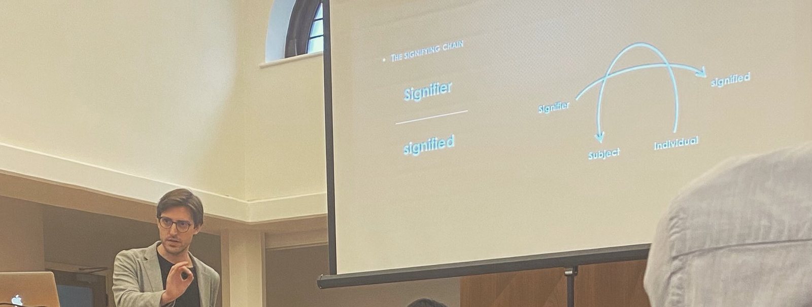 Albert C. Cano presenting a slide on the signifying chain