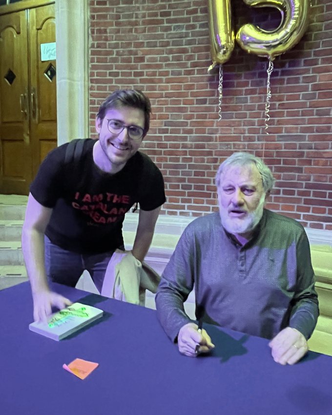 Albert C. Cano with Slavoj Žižek at a book signing